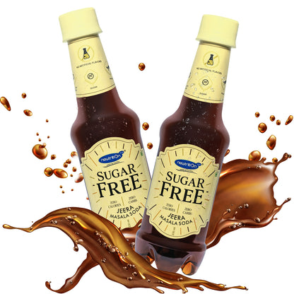 Two bottles of Sugar Free Jeera Masala Soda by Super Bio, arranged with a dynamic splash of dark brown soda around them on a white background.